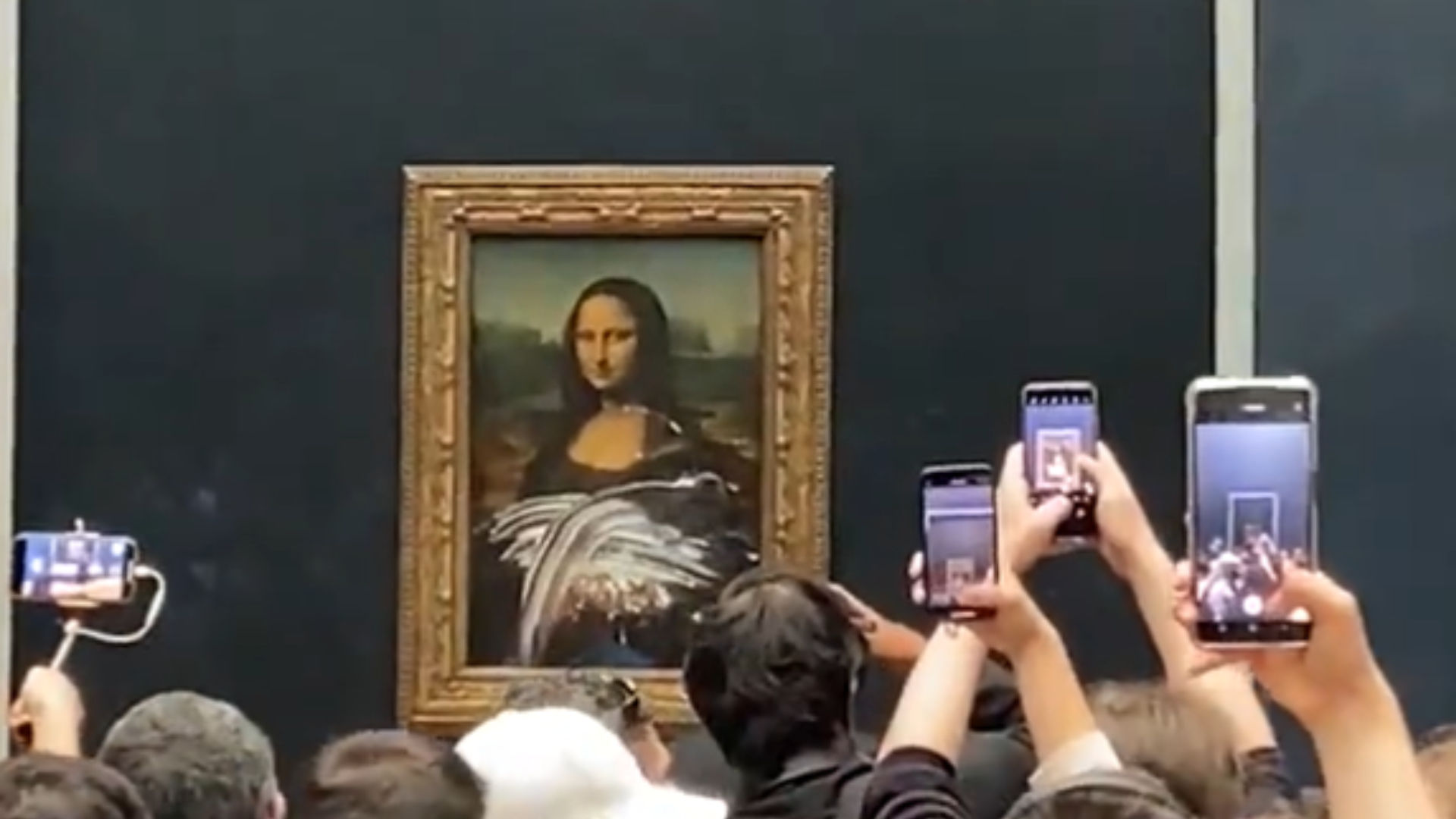 Watch: Man disguised as 'old woman' attacks Mona Lisa with cake