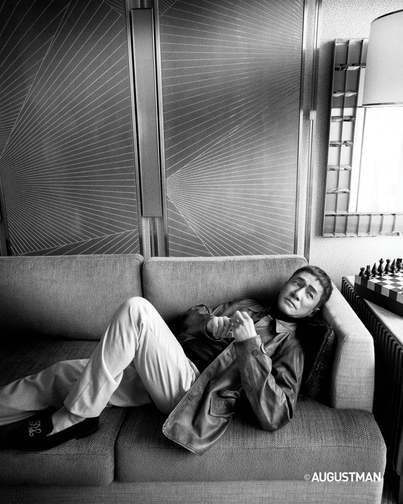 Tony Leung is wearing a turtleneck pullover, pants and velvet slippers, from Ralph Lauren Purple Label, and a leather jacket from Double RL.